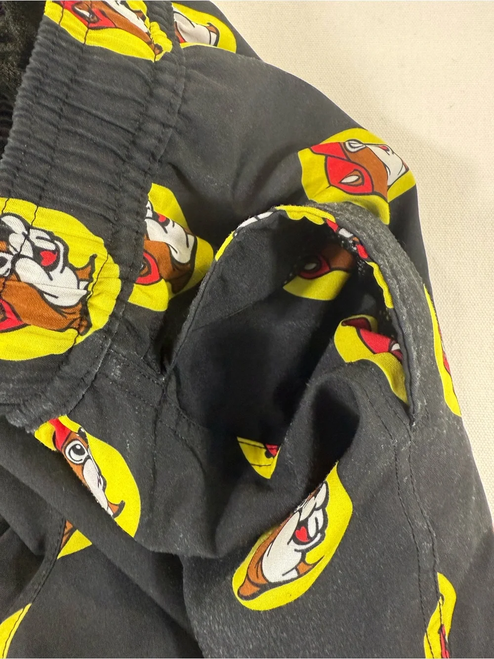 Kids Black Graphic Swim Shorts with Yellow & Red Badge Print
